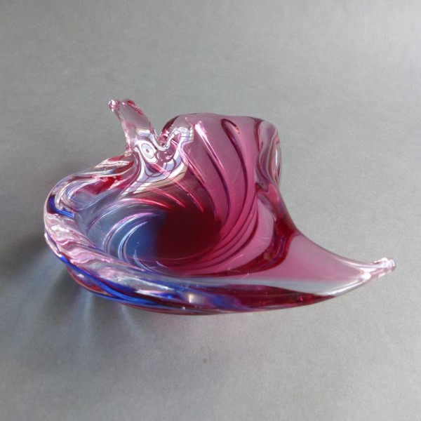 Colorful glass bowl in leaf...