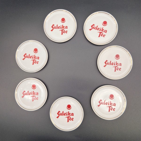 Seven porcelain coasters by...